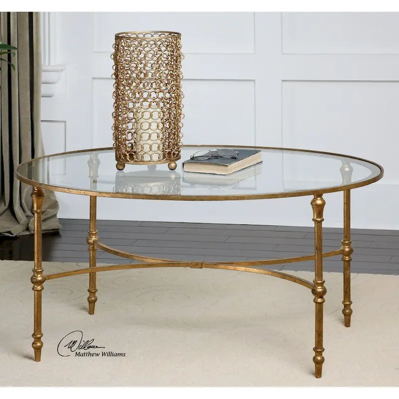 Table basse ovale à plateau en verre clair et doré, pieds en métal, 1 pièce